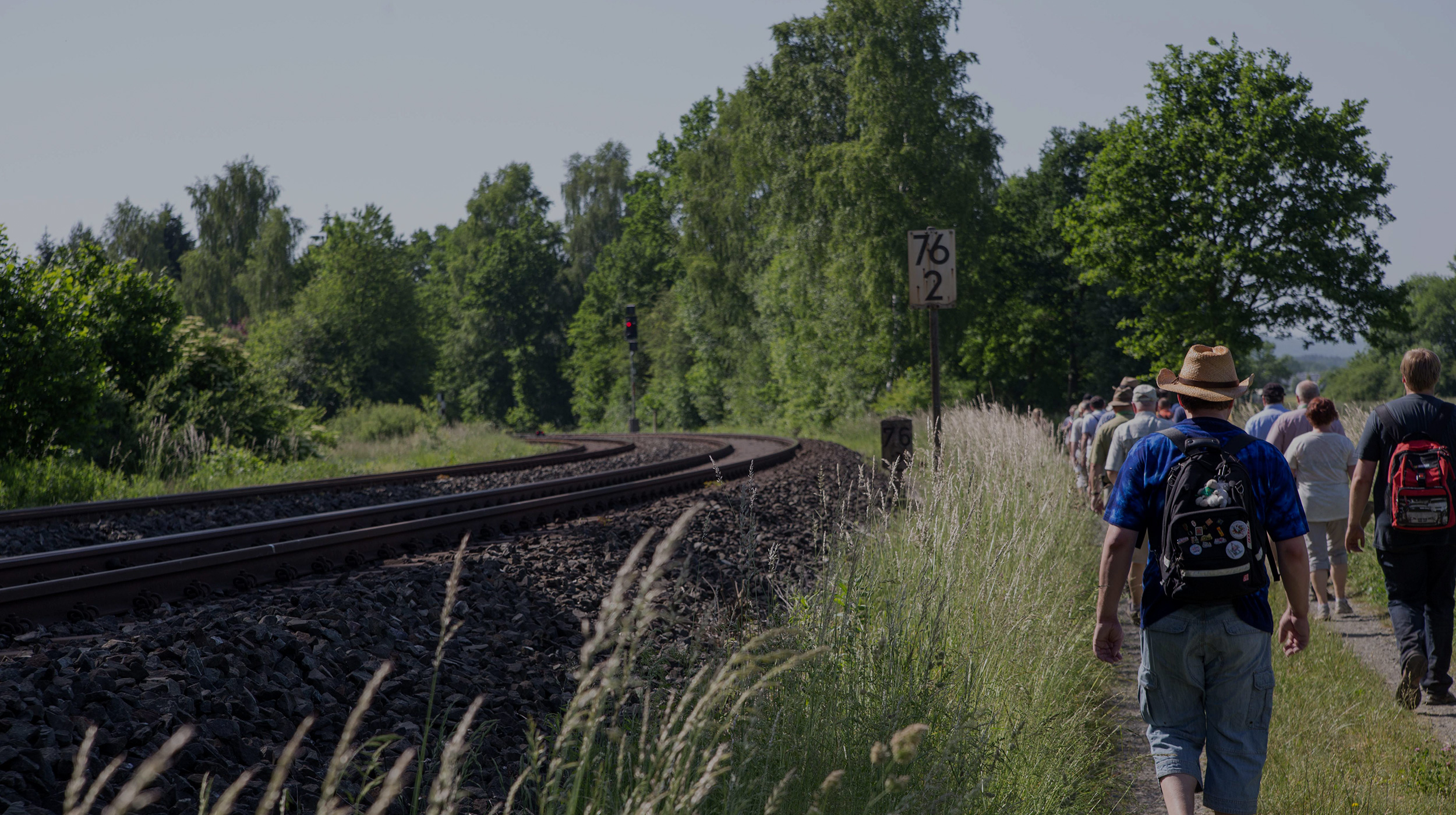 A group of railfans travelling along the Schiefe Ebene on a sunny day